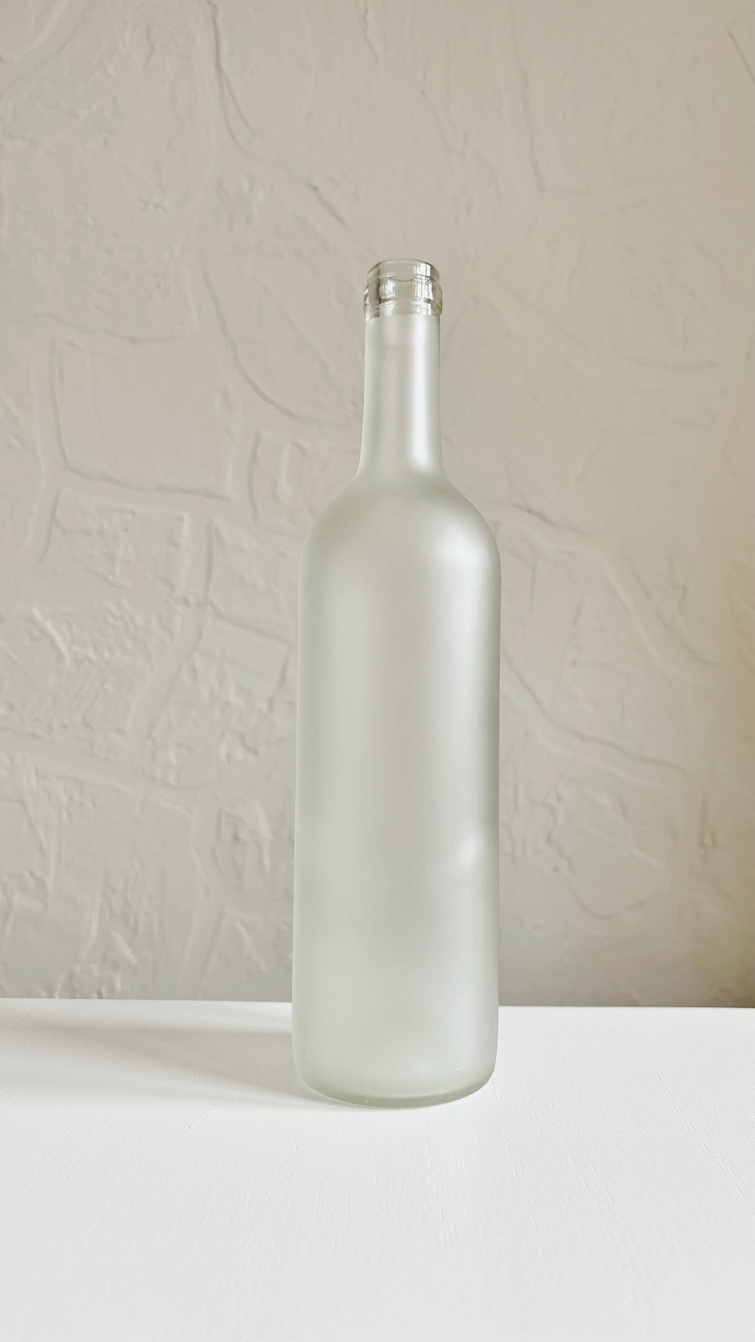 Bouteille en verre givrée